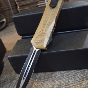 OTF knife with 6-in dual serrated blade. (TAN)